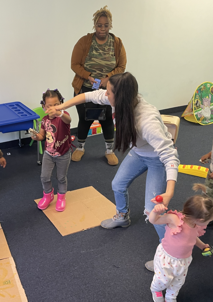 A group of kids dancing and experiencing music therapy